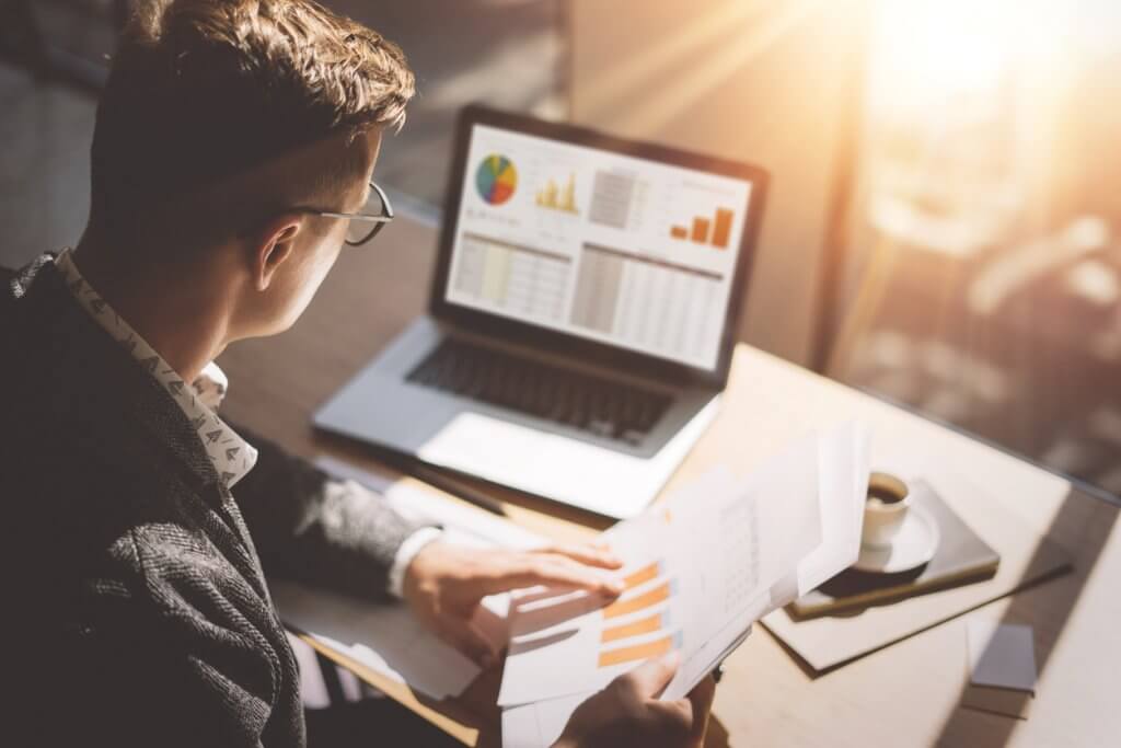 businessman using Tsheets payroll system to track time worked