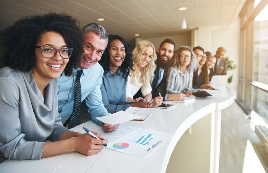 smiling employees of outside accounting firm